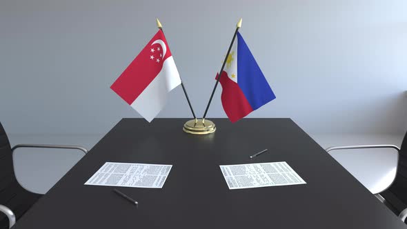 Flags of Singapore and the Philippines and Papers