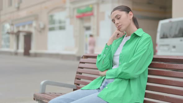 Tired Hispanic Woman Sleeping While Sitting Outdoor on Bench