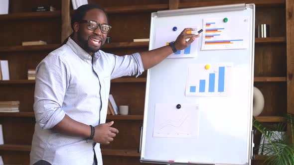 Young African American Employee Explaining Project