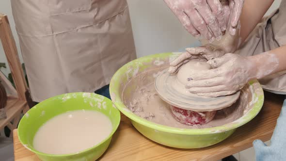 Romantic Couple in Love Working Together on Potter Wheel and Sculpting Clay Pot