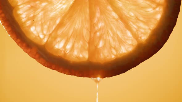 Juicy Orange Slice on Orange Background