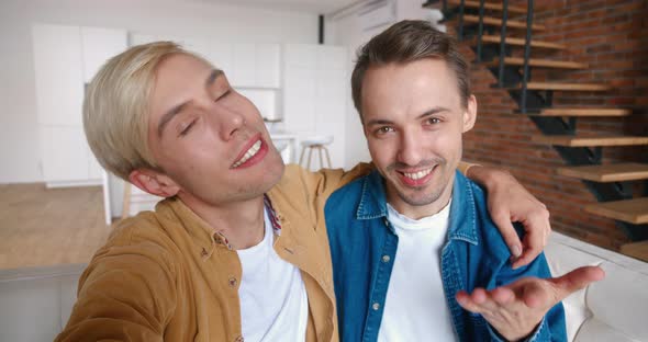 POV of Homosexual Couple Hugging and Talking to Camera When Having Videochat