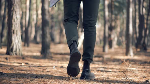 Modern Stylish Man Walking. Guy Walking And Relaxing In Park. Autumn Hiking On Forest Trail.