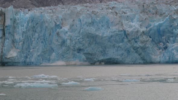 Slow motion calving of the melting Sawyer glacier in Tracy Arm, Alaska 4K