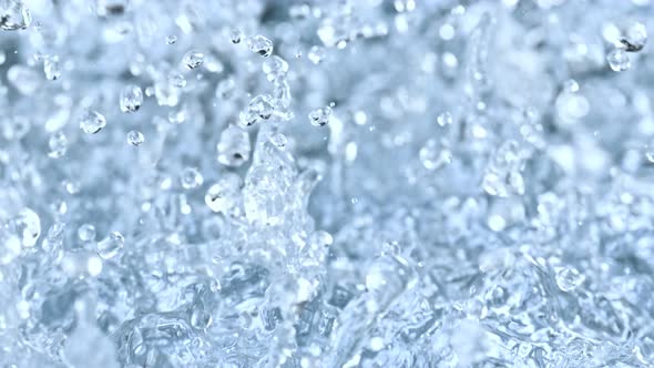 Super Slow Motion Abstract Shot of Splashing Blue Clear Liquid Background at 1000Fps