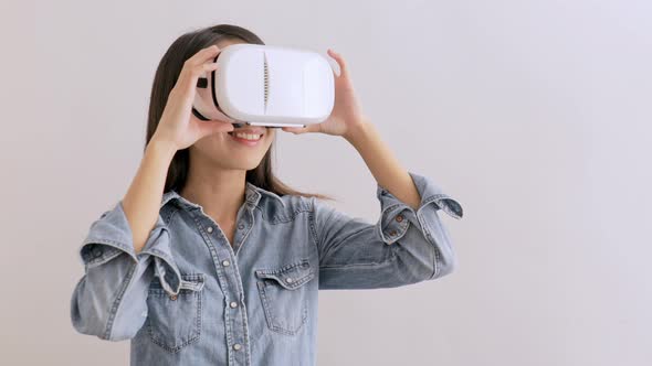 Woman looking though virtual reality device