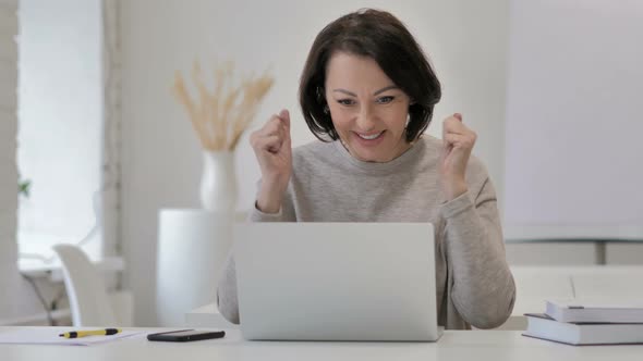 Excited Old Senior Woman Celebrating Success, Working on Laptop