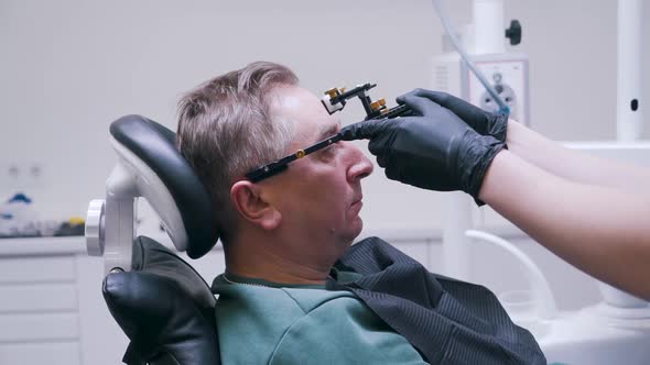 Patient Is Fixed the Jaw in the Dental Clinic