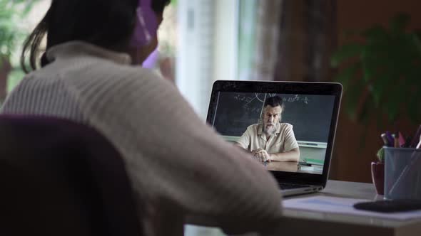 Student Learning Watching Online Video Class Call with Math Professor From Home