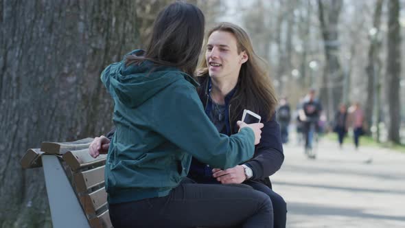 Friends talking in a park