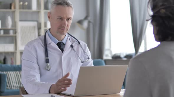 Doctor Talking with Patient in Clinic