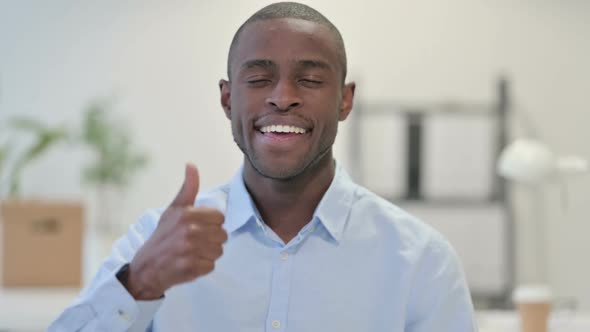 Portrait of African Man Showing Thumbs Up in Office