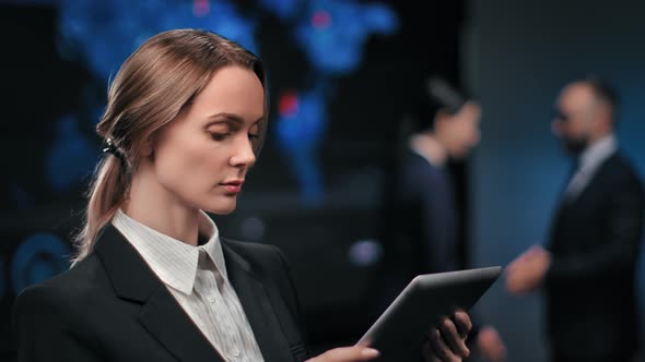 Trendy Businesswoman Use Tablet at Hi Tech Stock Exchange