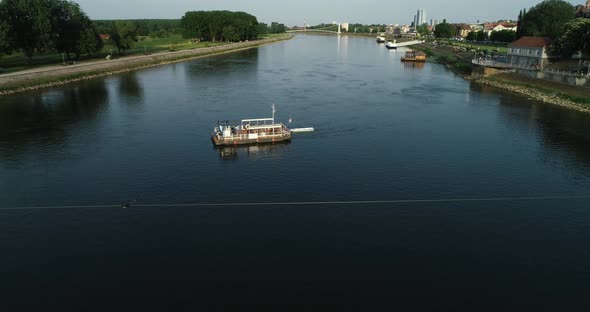 Aerial view of a passenger ferry boat crossing Drava river, Osijek, Croatia.