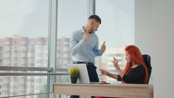 Businessman and Manager Dance in the Business Office After a Successful Deal. Office Workers Man and