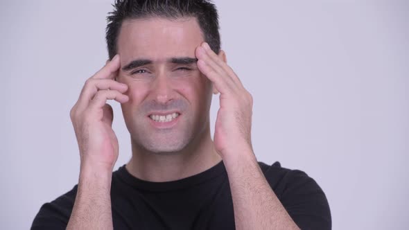 Face of Stressed Man Having Headache Against White Background