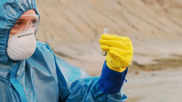 Female Ecologist With Test Tube