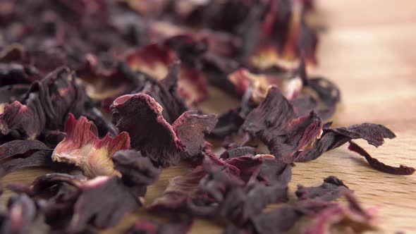 Herbal flower red hibiscus tea on a kitchen board