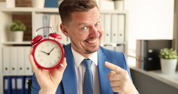Portrait of Smiling Manager Holding Red Alarm Clock for Ten in Morning  Movie
