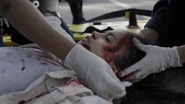 Paramedics Helping Injured Indian Girl After Car Accident