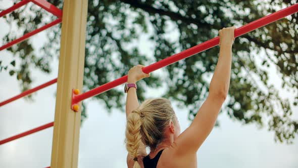 Fitness Girl Doing Sports Outdoors Lifting Weights. Fit Girl In Sportswear Exercising.