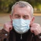 Close Up Portrait of Senior Man Wearing Protective Medical Face Mask.  - VideoHive Item for Sale
