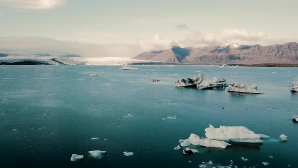 Diamond Beach Jokulsarlon Glacier Lagoon Icebergs in Iceland Aerial Drone View.