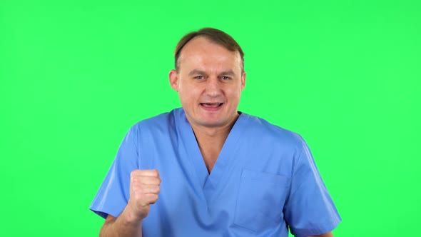 Medical Man Is Dancing Funny, Rejoices. Green Screen