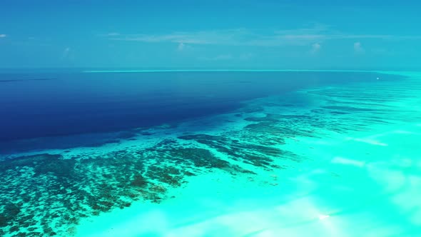 Beautiful birds eye abstract view of a sandy white paradise beach and blue sea background