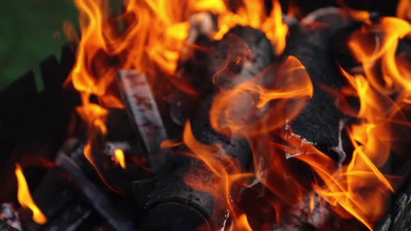 Hot embers of burning wood log fire
