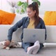 Woman Stroking Dog and Working with Laptop Sitting By Sofa in Apartment Interior Spbi - VideoHive Item for Sale