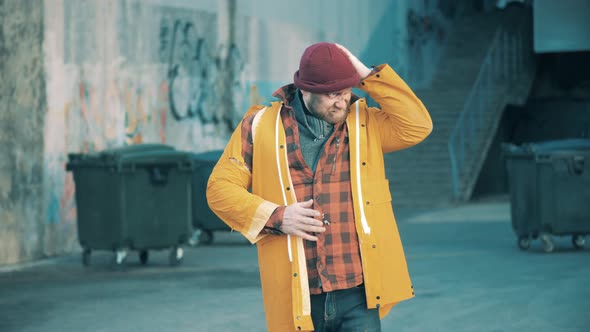 A Homeless Man Takes a Massive Bag Off the Ground