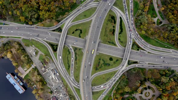 Aerial view of Traffic in the big City. Rush Hour on intersection circle.