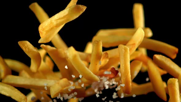 Super Slow Motion French Fries with Salt Soars Into the Air