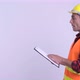 Profile View of Young Happy Hispanic Man Construction Worker Showing Clipboard and Giving Thumbs Up - VideoHive Item for Sale