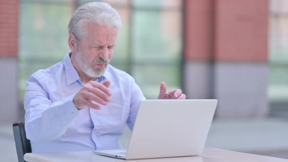 Outdoor Old Man with Headache Using Laptop