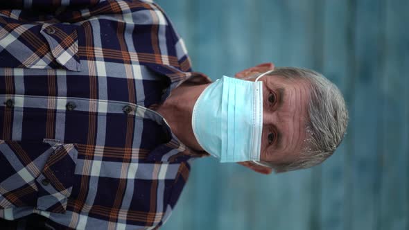 An Old Man Is Using Face Mask for Protect From Virus Against the Second Wave Quarantine Coronavirus