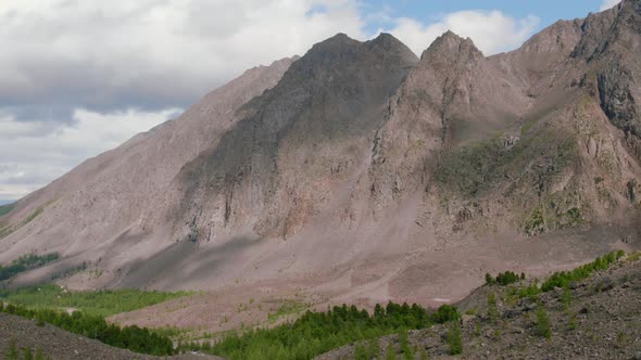 High mountains of Aktru valley with river and forest