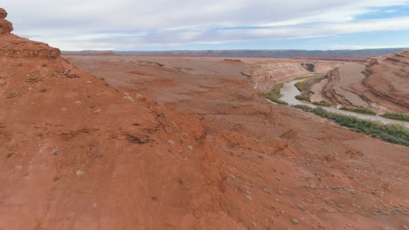 Arizona Desert View From the Drone Camera, Moving Fast Over the Ground Past the Stone Formation.