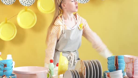 Attractive Awesome Girl in Gray Apron Using Brush As a Microphone
