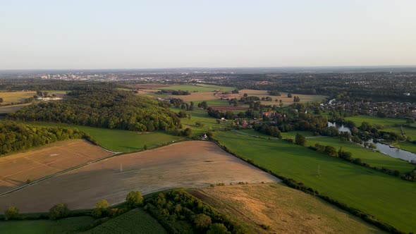 Cultivated fields in countryside around Berkshire, England. Aerial panning