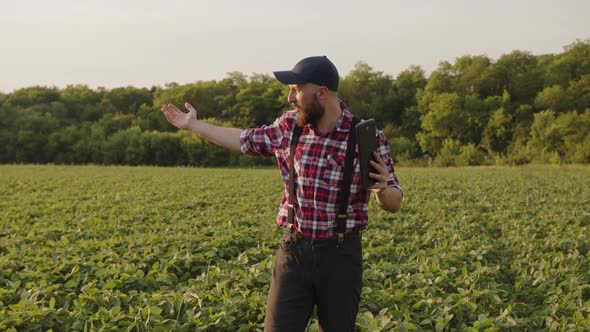 Farmer Explains Something to His Friends