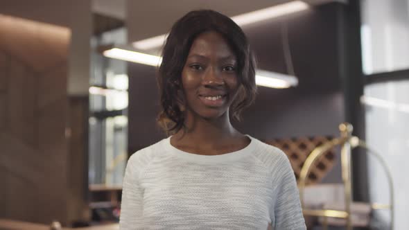 Portrait of Black Woman in Hotel Lobby