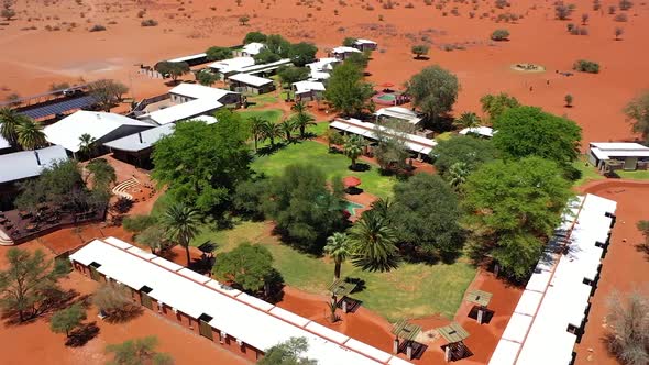 A beautiful lodge in Namibia with a pool in it filmed by drone