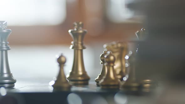 dolly shot of close up chess board game business strategy ideas concept with blur bokeh background