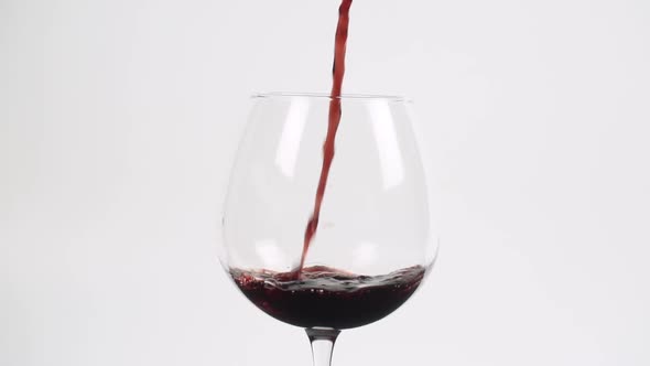 Red wine in burgundy glass close up slow motion 100fps