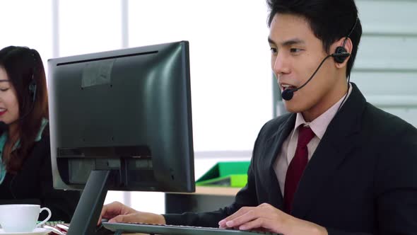 Business People Wearing Headset Working in Office