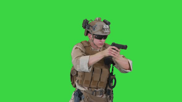 American Ranger with Pistol Aiming and Shooting on a Green Screen, Chroma Key.