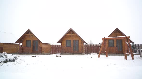 Panorama of snowy countryside wooden houses alt