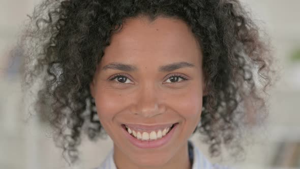 Close Up of Beautiful African Woman Smiling at Camera